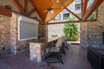 Outdoor cabana with tv, gas grills and wood burning fireplace